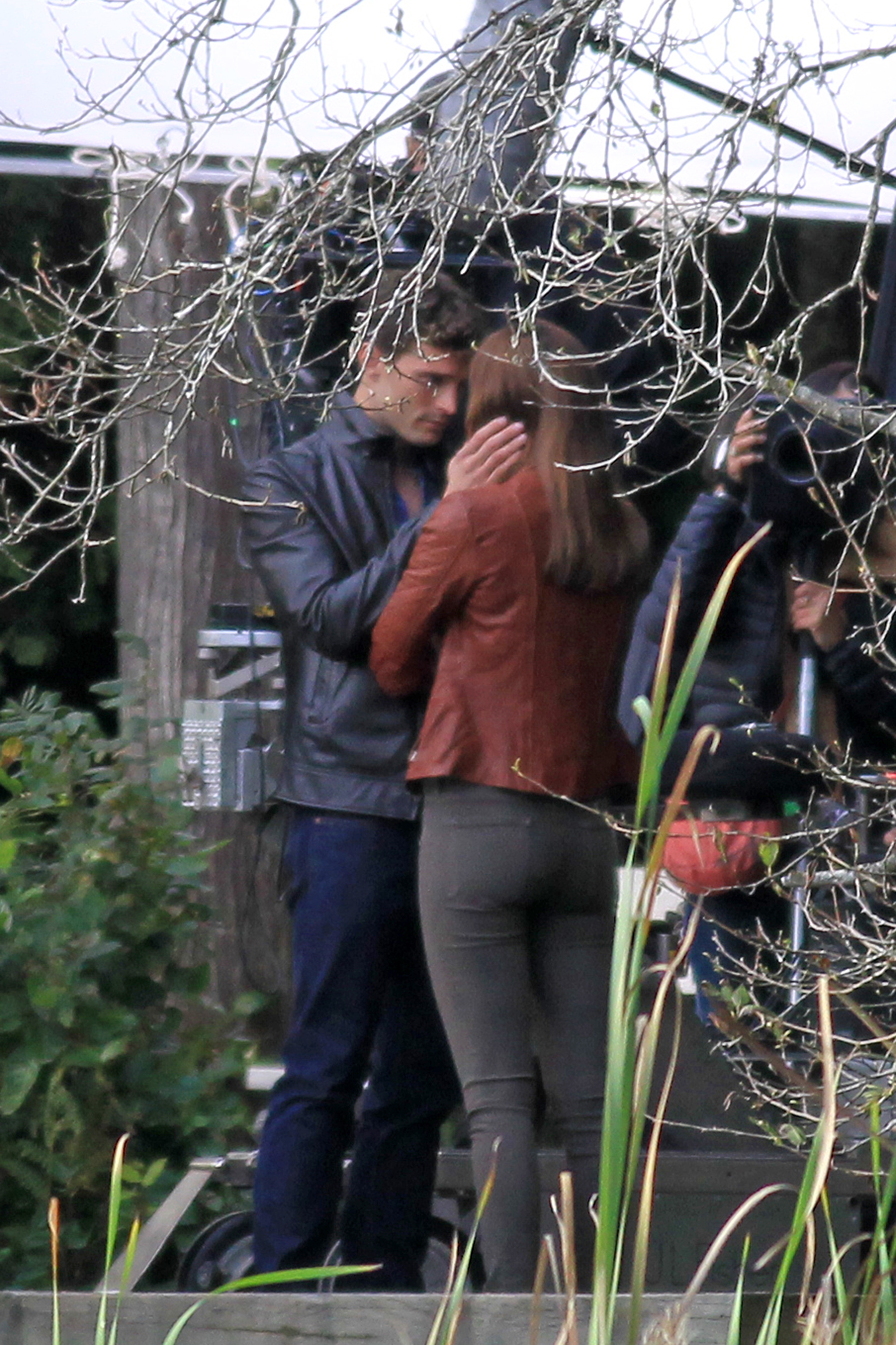 Jamie Dornan steals a kiss from Dakota Johnson for 'Fifty Shades of Grey'