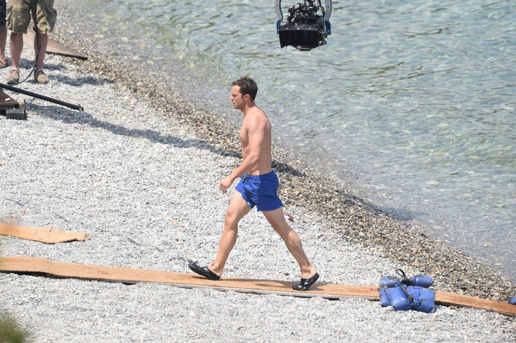 12 July 2016. Fifty Shades Of Grey, Dakota Johnson is seen topless filming scenes with Jamie Dornan on a beach in Nice. Credit: Neil Warner/GoffPhotos.com Ref: KGC-195